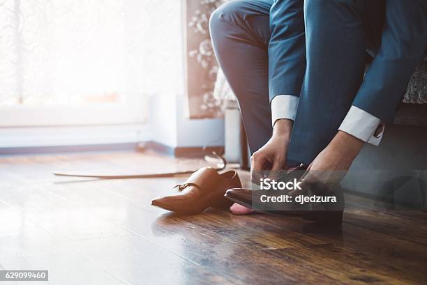 Groom Dressing Up With Classic Elegant Shoes Stock Photo - Download Image Now - Shoe, Men, Wedding