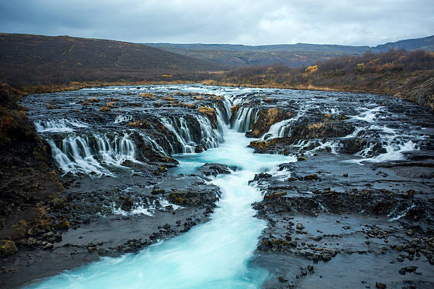 istock Blue Water Running On Black Bedrock 629101736