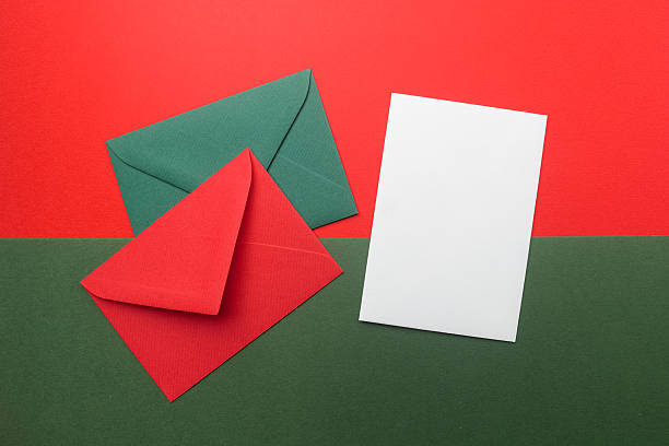 istock Red and green envelopes on christmas holiday background. Flat lay. 629127336