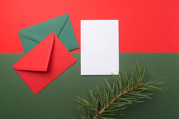 istock Red and green envelopes on christmas holiday background. Flat lay. 629127738