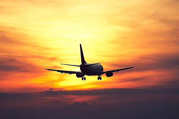 istock Airplane at the sunset 629128944