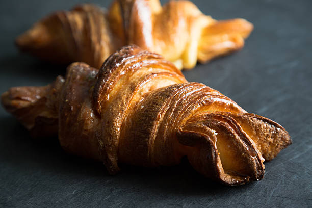 istock Fresh croissants on a dark background 629128978