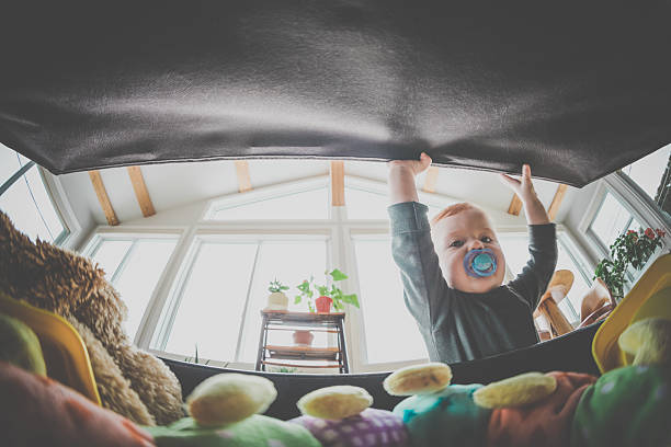 istock POV Baby Boy Opening Exploring and Looking Inside Toy Box 629129448