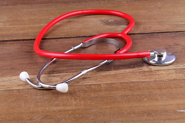istock stethoscope equipment on wood floor 629129452