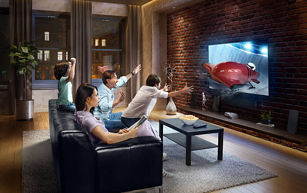 istock Family with children watching Bobsleigh competition on TV 629142414