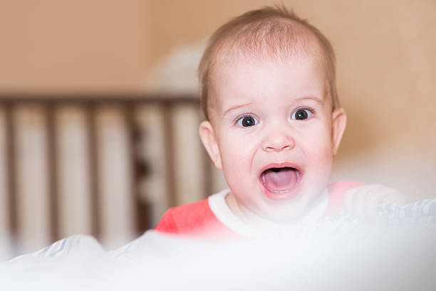 istock naughty little boy standing on the floor 629143330