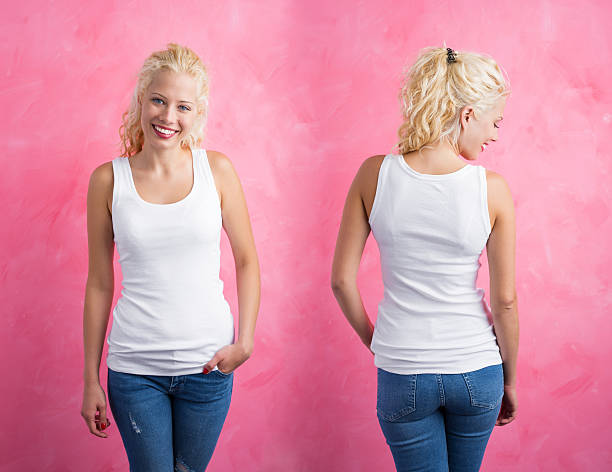 istock Woman in white tanktop on pink background 629143820