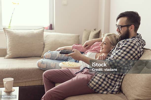 Couple Watching A Movie Stock Photo - Download Image Now - Television Set, Television Industry, Domestic Life