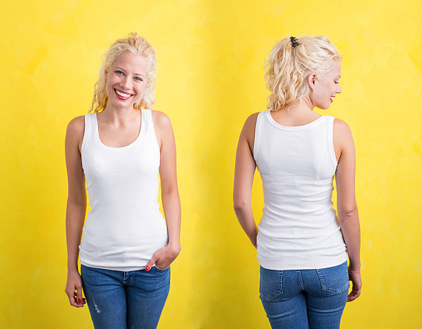 istock Woman in white tank top on yellow background 629144476