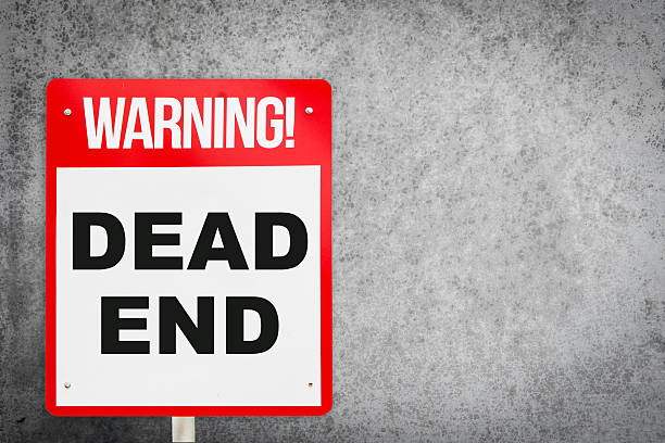 istock Dead End warning sign with gray cement wall. 629144528