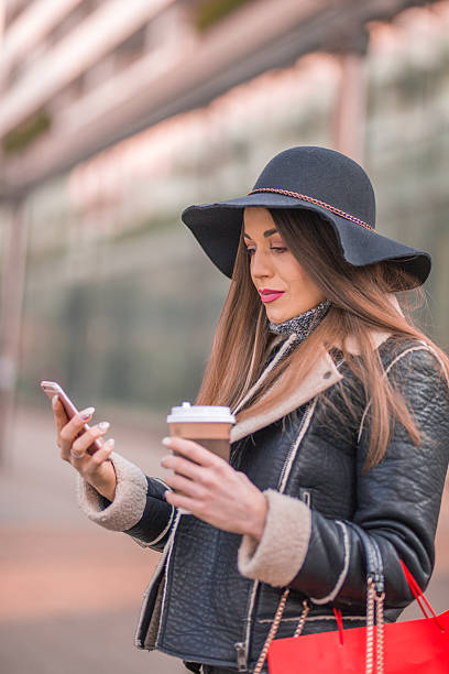 istock Business woman texting on her phone. 629145268