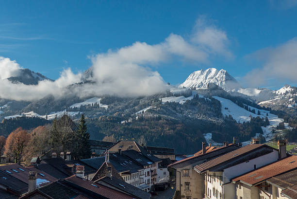 the picture perfect village of gruyeres with the dramatic backdrop of moleson mountain in the canton of fribourg, switzerland.