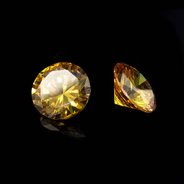 istock Yellow gems on a black background 629156814