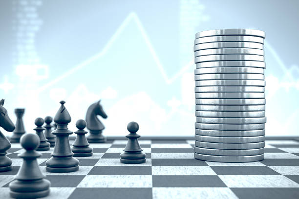 istock Pawn and chess pieces versus money on a blue background 629162954