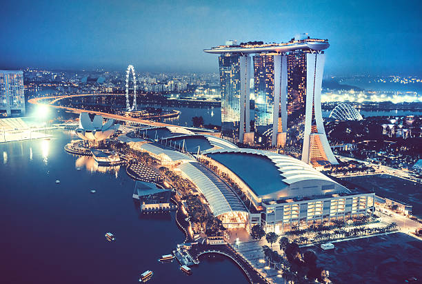 Aerial View Over Singapore  with Marina Bay Sands Hotel, Singapore Singapore, Singapore - November 02, 2016: Aerial View Over Singapore to the Marina Bay Sands Hotel at dusk. singapore city stock pictures, royalty-free photos & images