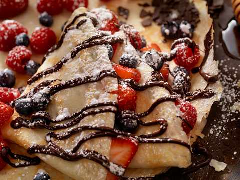 Crepes with Fresh Berries, Chocolate Sauce and Powdered sugar -Photographed on a Hasselblad H3D11-39 megapixel Camera System