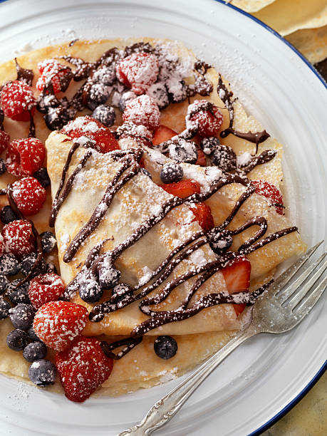 istock Crepes with Fresh Berries, Chocolate Sauce and Powdered sugar 629182074