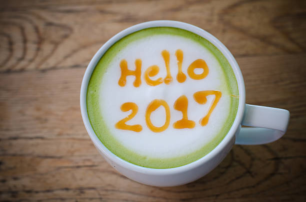 istock green tea with foam milk art 2017 on wooden table 629182376