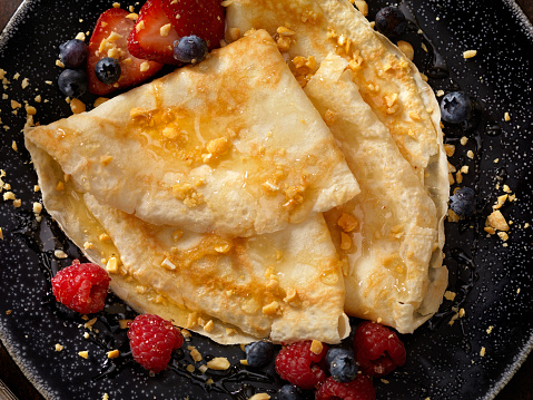 Crepes with Honey, Nuts and Fresh Berries -Photographed on a Hasselblad H3D11-39 megapixel Camera System