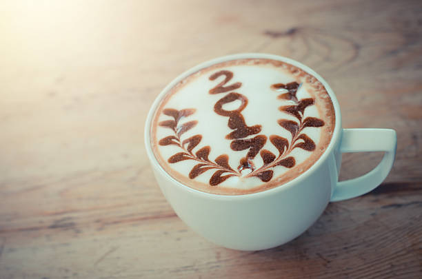 istock hot coffee with foam milk art 2017 on wooden table 629182712