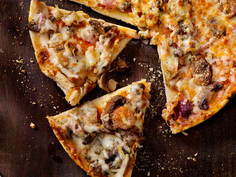 Roasted Mushroom, Garlic and Red Onion Thin Crust Pizza  - Photographed on a Hasselblad H3D11-39 megapixel Camera System