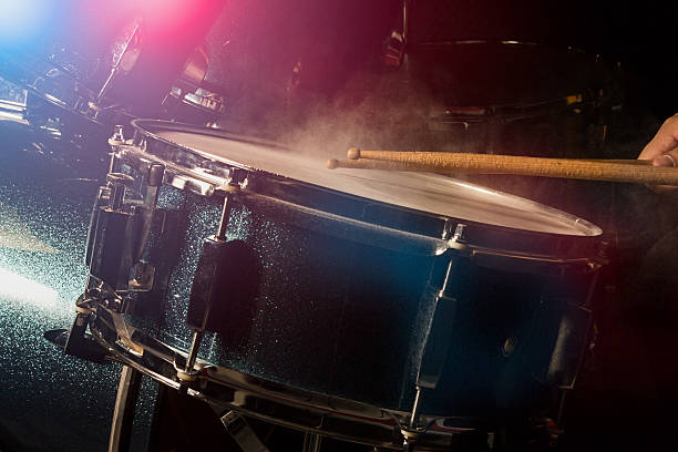 The man is playing drumset stock photo