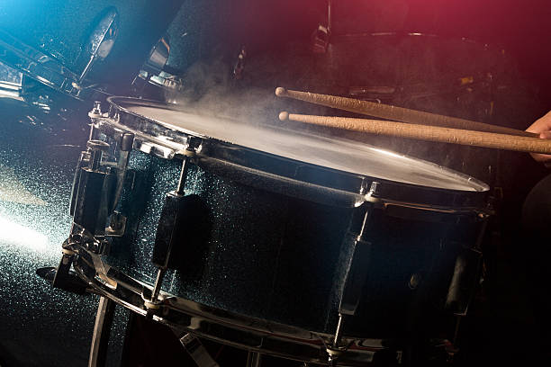 The man is playing drumset stock photo