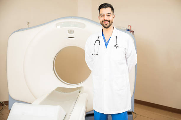 istock Doctor next to a CT scanner 629185718