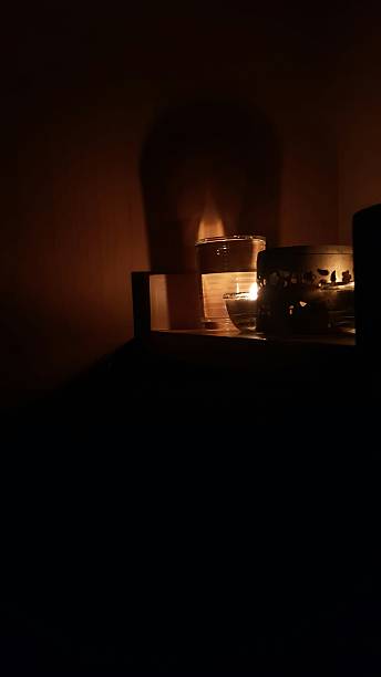 istock Candle light in the dark room. 629186382