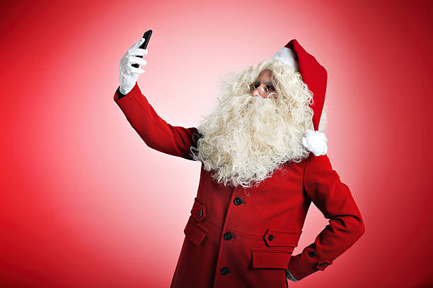 istock Santa with gadgets in hands 629187038