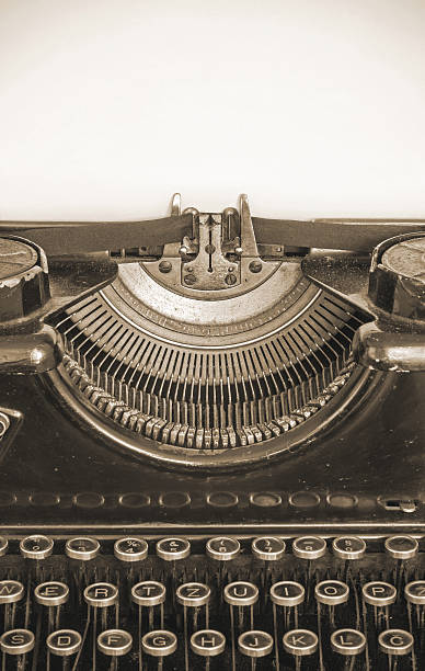 istock Old typing machine and blank sheet of paper for text 629187104