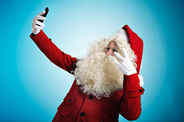 istock Santa with gadgets in hands 629187140