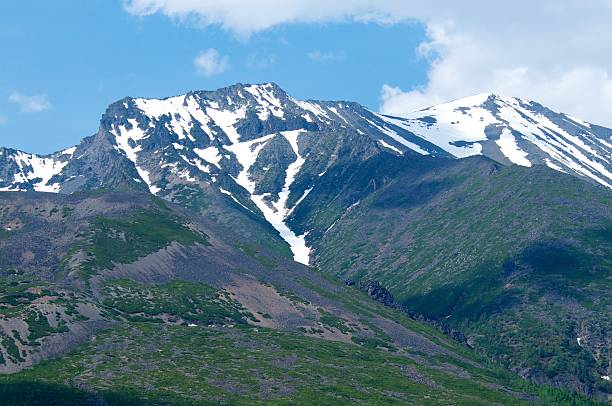 istock Snow-capped mountains on summer with sunset and blue sky 629188914