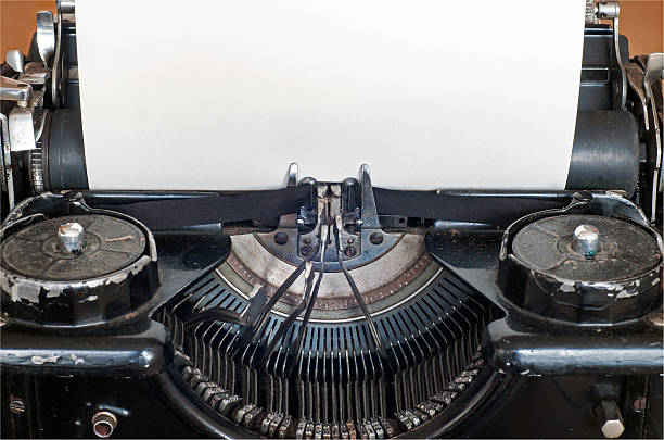 istock Old typing machine and blank sheet of paper for text 629188996