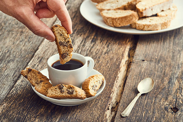 istock Hand dip  cantucci in the coffee. Typical Italian cookies 629189748
