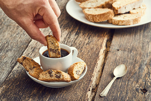 istock Hand dip  cantucci in the coffee. Typical Italian cookies 629189942