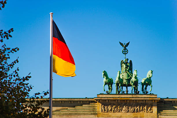 istock German flag at Brandenburg Gate 629190394
