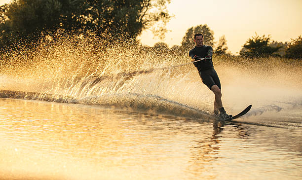 istock Man riding wakeboard in a lake 629190428