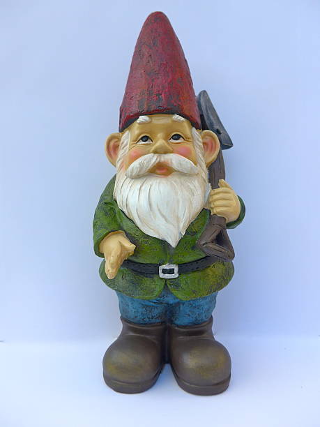 istock Garden dwarf with red hat against white background 629202250
