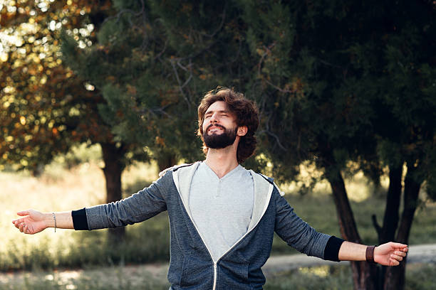 istock Young smiling man enjoying environment, free space 629203036
