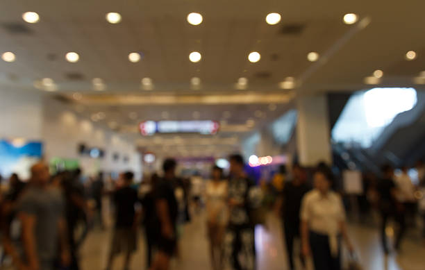 istock blurred people in trade show expo. 629203042