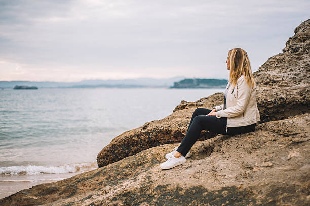 istock Woman by the sea 629204308