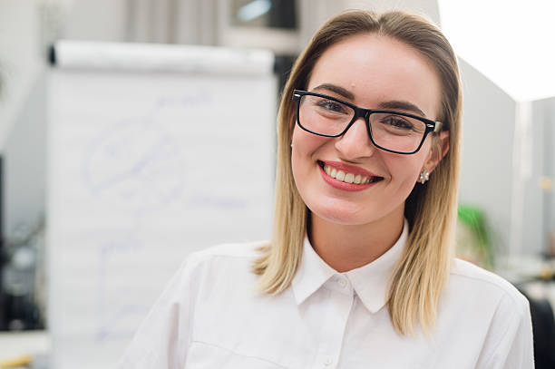 istock Pretty blonde designer smiling at camera in creative office 629209726