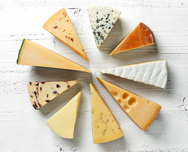 various types of cheese various types of cheese on white wooden table, top view brie stock pictures, royalty-free photos & images