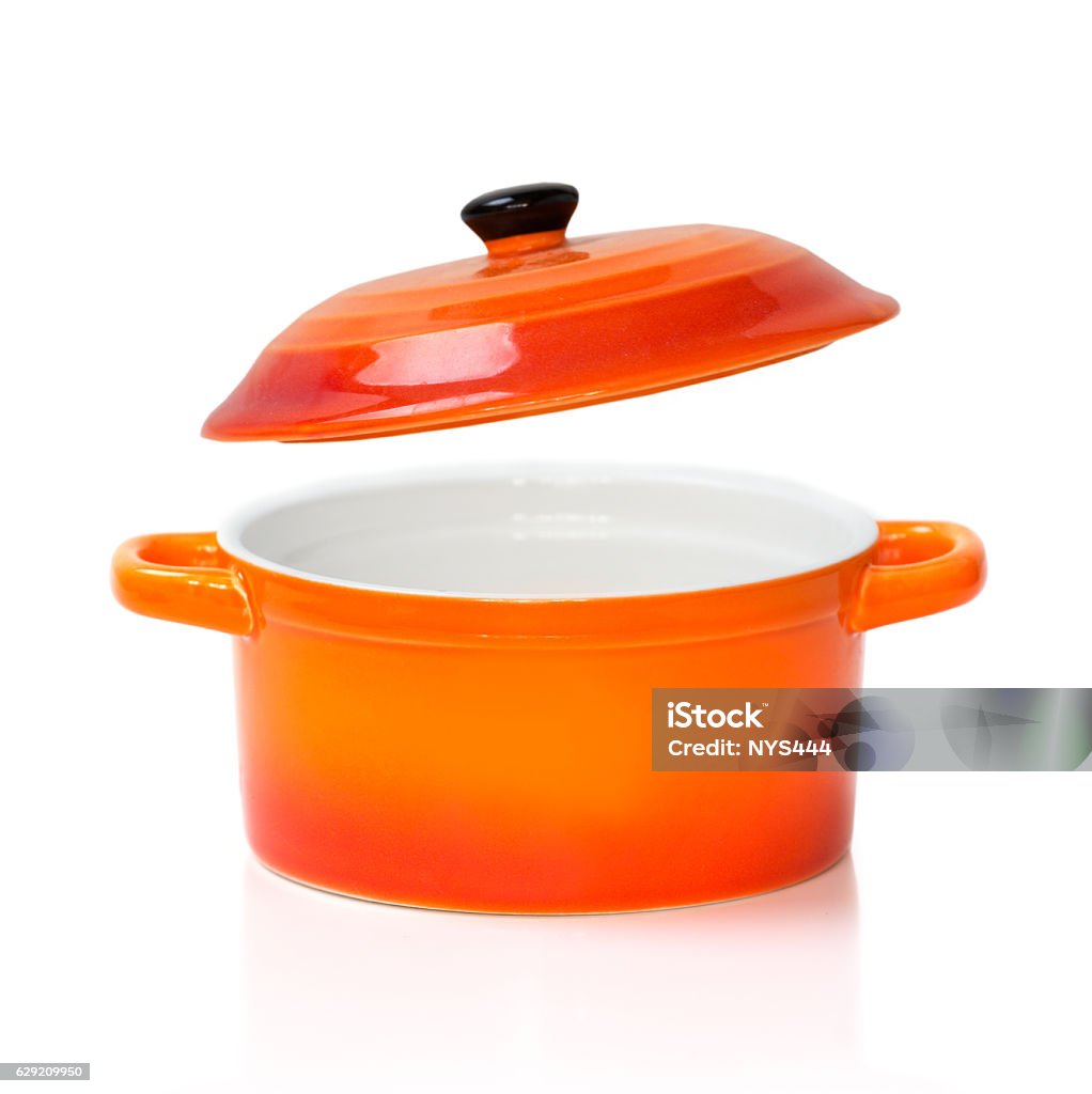 Red orange ceramic pot pan opened cover isolated. Orange red ceramic cooking kitchen pot pan with an open cover opened isolated on white. Cooking Pan Stock Photo