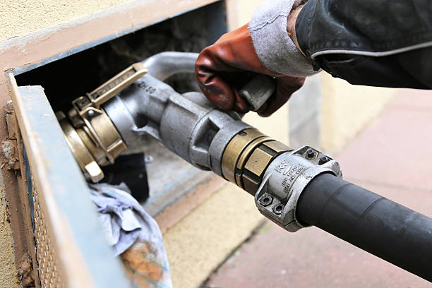 Heating oil is delivered Heating oil is delivered to a house / residential fossil fuel stock pictures, royalty-free photos & images