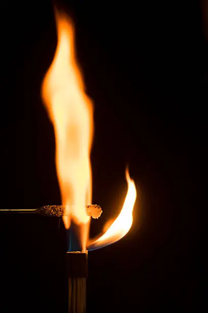 Photo of Sodium chloride burning in air with orange flame