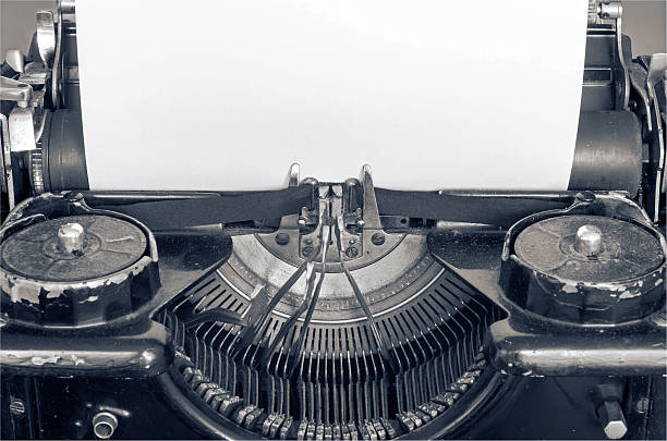 istock Old typing machine and blank sheet of paper for text 629213668