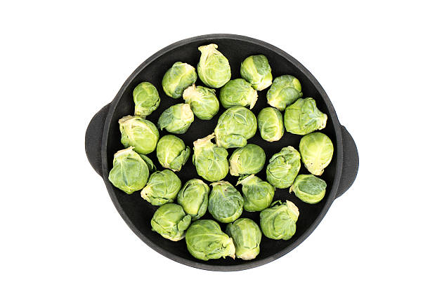 Raw brussels sprouts in pan