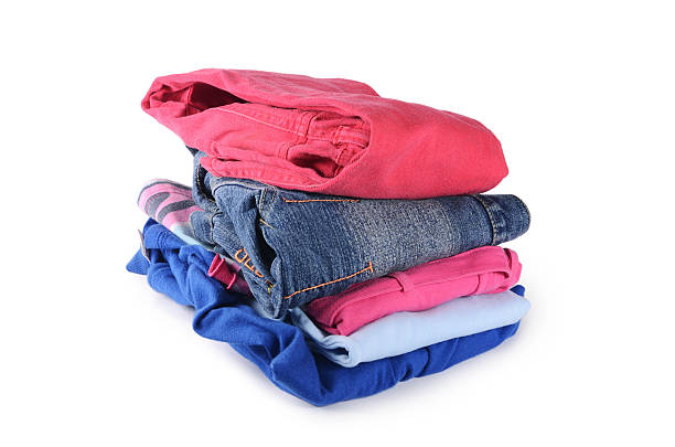 istock Pile of clothes isolated on white 629215398